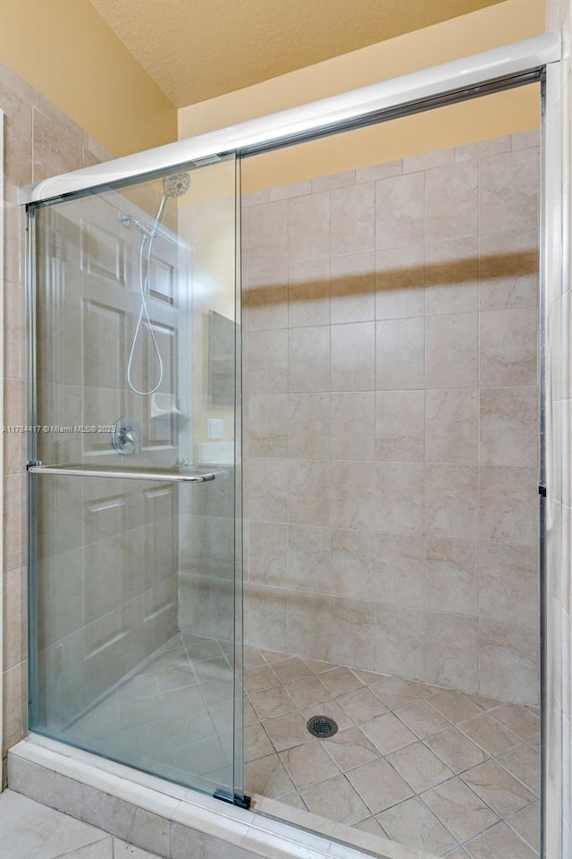 bathroom featuring a stall shower