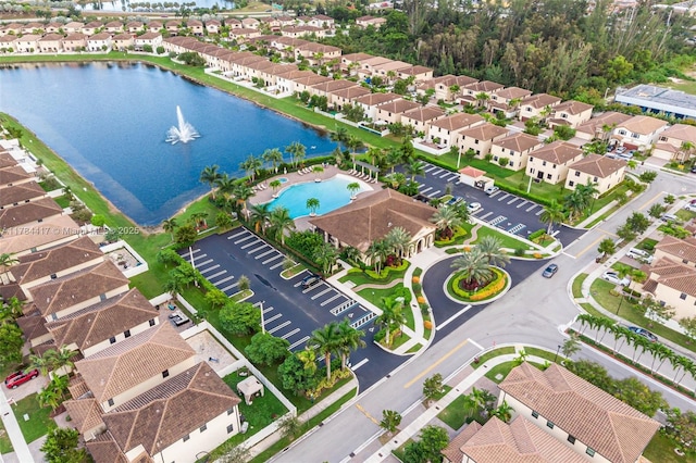 birds eye view of property featuring a water view and a residential view
