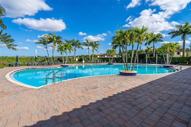 community pool with a patio area