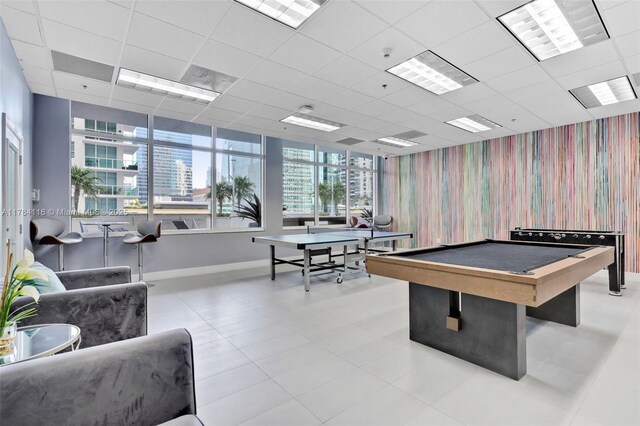 1200 Brickell Bay Dr Unit 1723, Miami, FL 33131 - playroom featuring a wealth of natural light, billiards, baseboards, and wallpapered walls
