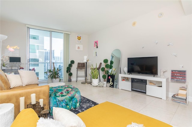 living room featuring tile patterned floors and baseboards