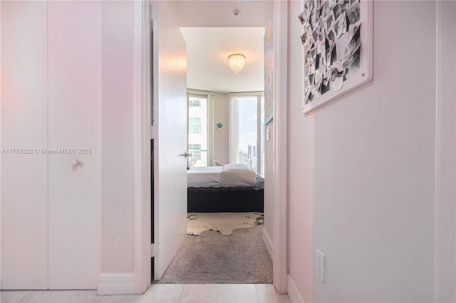 hallway with light tile patterned floors