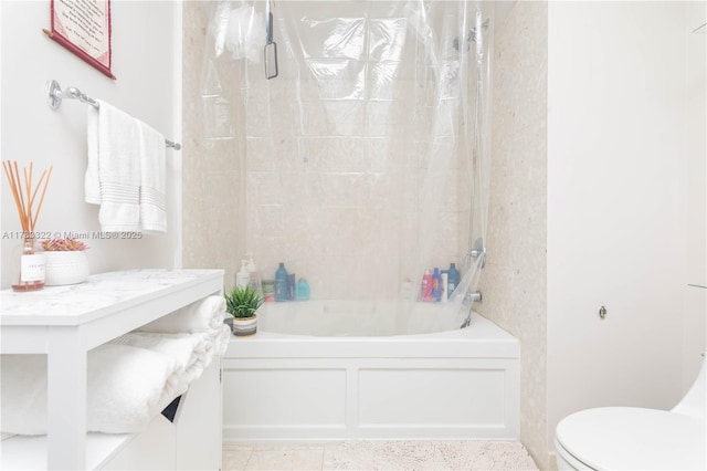 bathroom featuring toilet and shower / tub combo with curtain