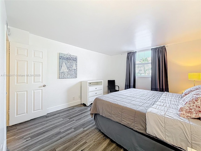 1913 S Ocean Dr Unit 110, Hallandale Beach, FL 33009 - bedroom featuring baseboards and wood finished floors
