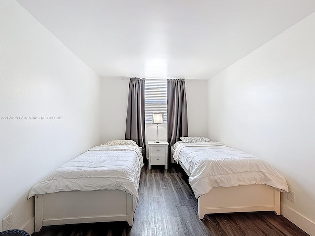 1913 S Ocean Dr Unit 110, Hallandale Beach, FL 33009 - bedroom with baseboards and dark wood finished floors
