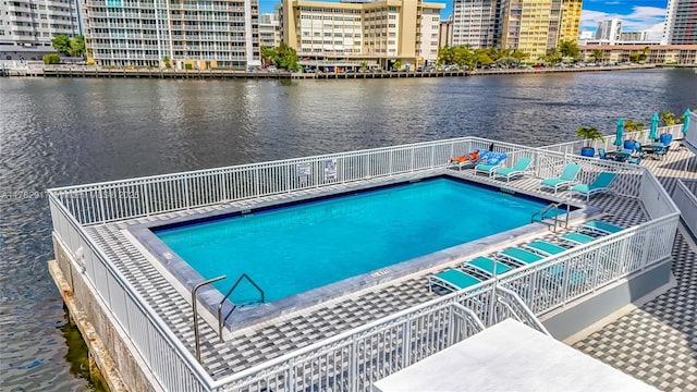 1913 S Ocean Dr Unit 110, Hallandale Beach, FL 33009 - community pool featuring a water view, a view of city, and fence