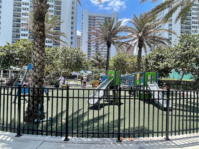 1913 S Ocean Dr Unit 110, Hallandale Beach, FL 33009 - view of gate featuring fence and a yard