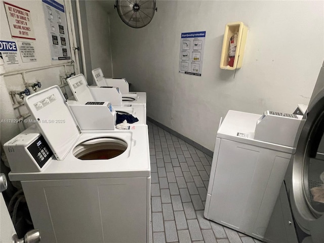 1913 S Ocean Dr Unit 110, Hallandale Beach, FL 33009 - community laundry room with washer and clothes dryer and brick floor