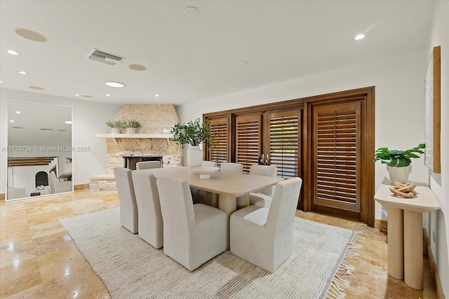551 S Mashta Dr, Key Biscayne, FL 33149 - dining space featuring visible vents, baseboards, a stone fireplace, and recessed lighting