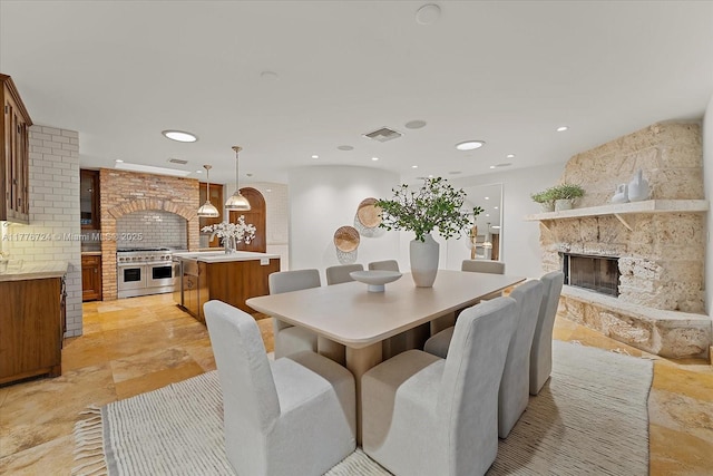 551 S Mashta Dr, Key Biscayne, FL 33149 - dining area with a fireplace, visible vents, and recessed lighting