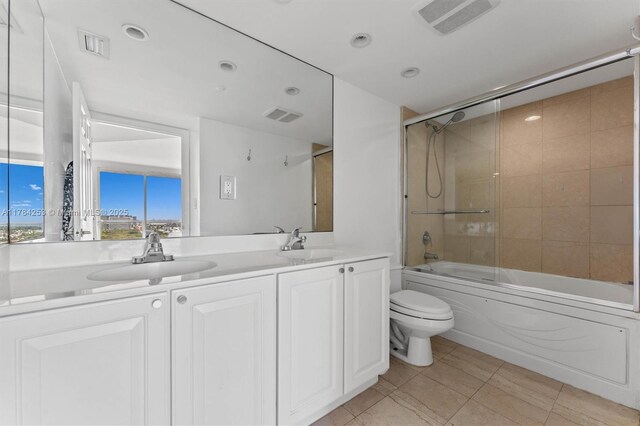 7330 Ocean Ter Unit 20-B, Miami Beach, FL 33141 - bathroom with double vanity, toilet, visible vents, and a sink
