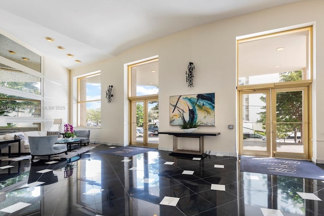 333 Sunset Dr Unit 804, Fort Lauderdale, FL 33301 - entryway featuring french doors, a high ceiling, granite finish floor, and baseboards
