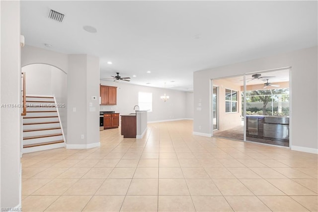 19726 Tesoro Way, Estero, FL 33967 - unfurnished living room with recessed lighting, baseboards, visible vents, and ceiling fan with notable chandelier
