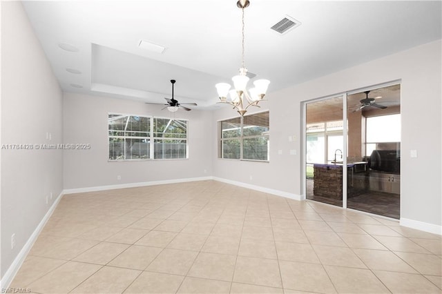 19726 Tesoro Way, Estero, FL 33967 - spare room with a raised ceiling, baseboards, visible vents, and ceiling fan with notable chandelier
