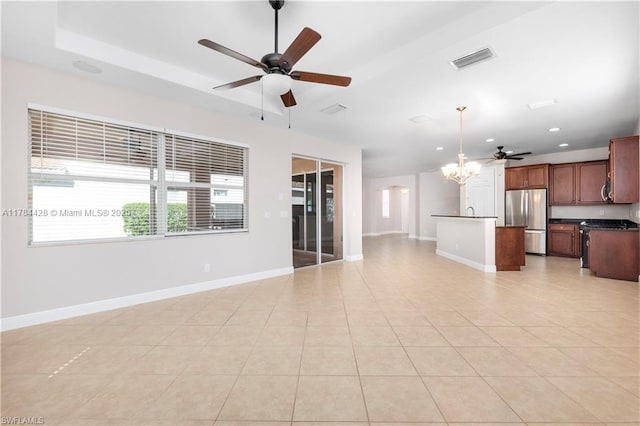 19726 Tesoro Way, Estero, FL 33967 - unfurnished living room featuring baseboards, visible vents, and ceiling fan with notable chandelier