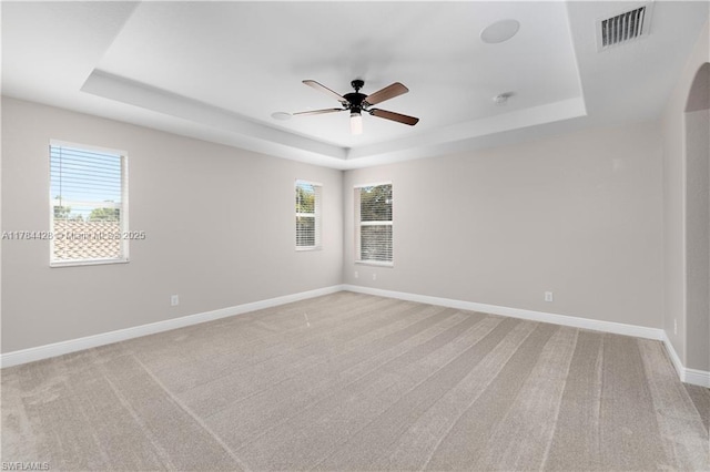 19726 Tesoro Way, Estero, FL 33967 - spare room featuring ceiling fan, light carpet, baseboards, a tray ceiling, and visible vents