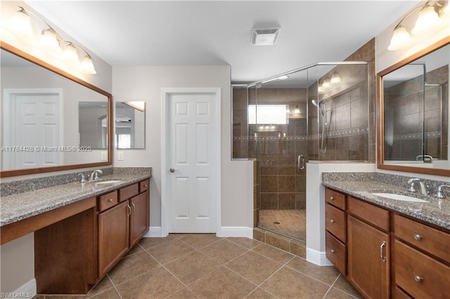 19726 Tesoro Way, Estero, FL 33967 - bathroom featuring a sink, tile patterned floors, two vanities, and visible vents