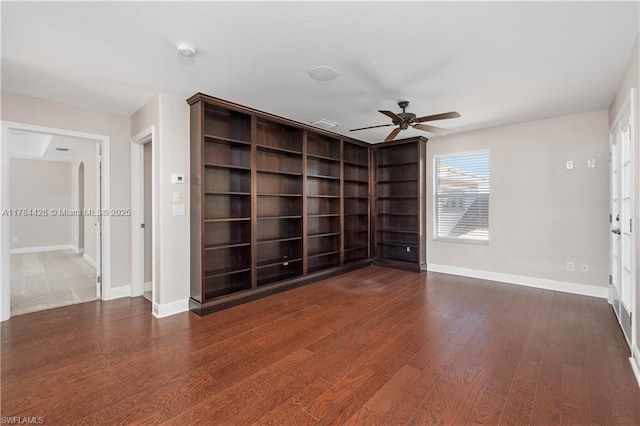 19726 Tesoro Way, Estero, FL 33967 - empty room featuring baseboards, a ceiling fan, and dark wood-style flooring