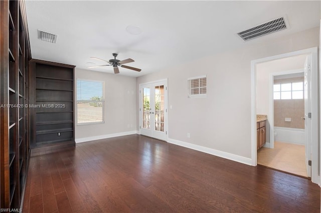 19726 Tesoro Way, Estero, FL 33967 - unfurnished room with dark wood-style flooring, ceiling fan, visible vents, and french doors