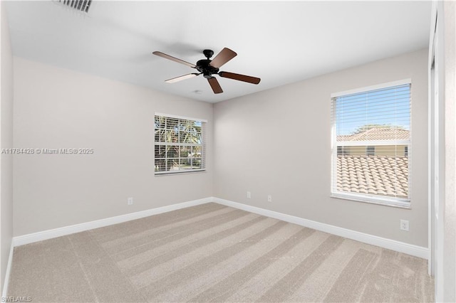 19726 Tesoro Way, Estero, FL 33967 - unfurnished room featuring light colored carpet, baseboards, ceiling fan, and visible vents