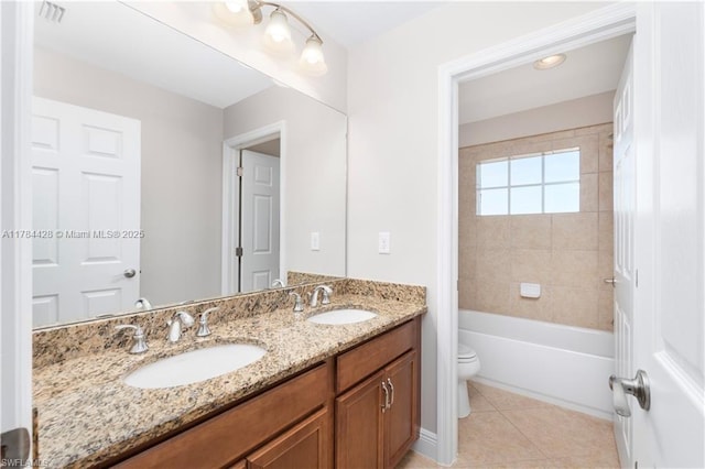 19726 Tesoro Way, Estero, FL 33967 - full bath with double vanity, toilet, tile patterned floors, and a sink