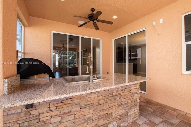 19726 Tesoro Way, Estero, FL 33967 - view of patio with a ceiling fan, exterior kitchen, and a sink