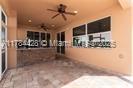 19726 Tesoro Way, Estero, FL 33967 - exterior space featuring ceiling fan