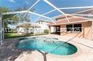 19726 Tesoro Way, Estero, FL 33967 - outdoor pool featuring a jacuzzi and a patio area