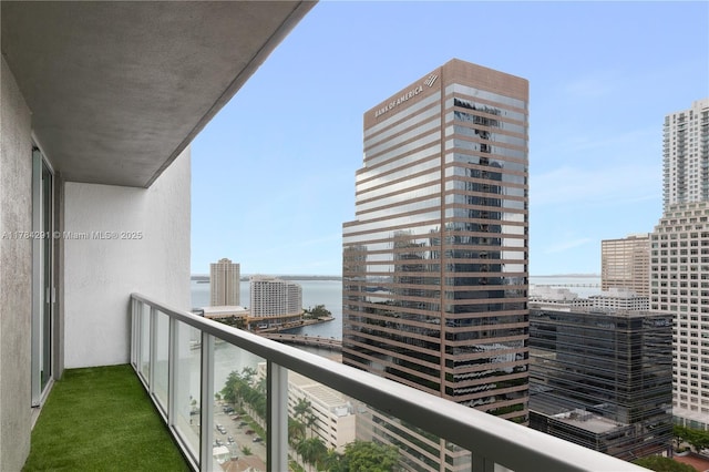 balcony with a city view and a water view