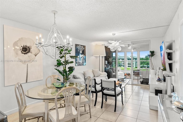 dining area featuring light tile patterned flooring, a notable chandelier, and a textured ceiling
