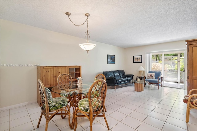 419 SW Natura Ave Unit C, Deerfield Beach, FL 33441 - dining room with light tile patterned floors and a textured ceiling