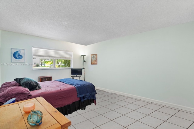 419 SW Natura Ave Unit C, Deerfield Beach, FL 33441 - bedroom with a textured ceiling and baseboards