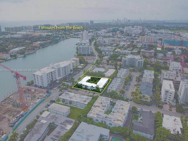 aerial view with a water view and a view of city