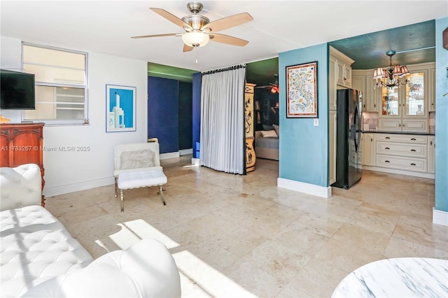 1811 Jefferson St Unit 203, Hollywood, FL 33020 - living room with baseboards, a chandelier, and a ceiling fan