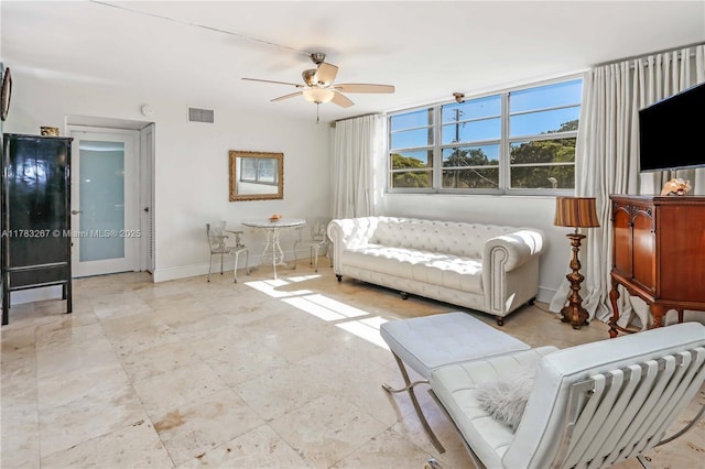 1811 Jefferson St Unit 203, Hollywood, FL 33020 - living area with a ceiling fan and baseboards