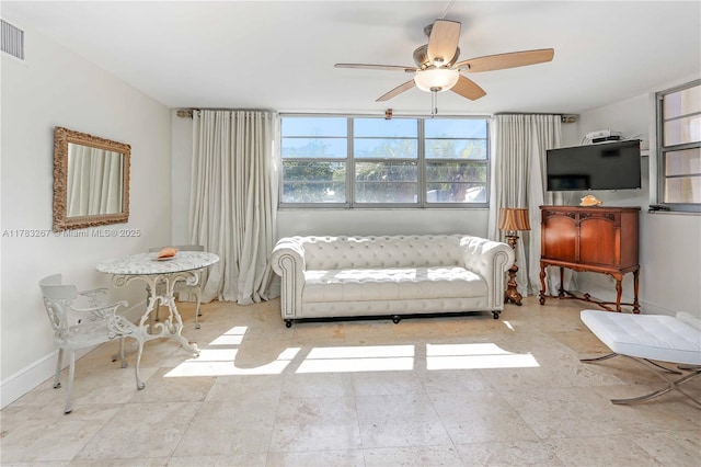 1811 Jefferson St Unit 203, Hollywood, FL 33020 - living area with ceiling fan and baseboards