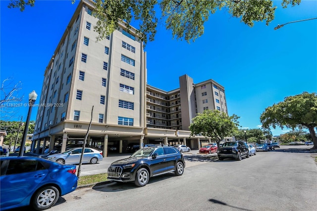 1811 Jefferson St Unit 203, Hollywood, FL 33020 - view of apartment building / complex featuring uncovered parking