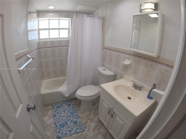525 Meridian Ave Unit 105, Miami Beach, FL 33139 - bathroom with vanity, toilet, shower / bath combo, tile walls, and a textured wall