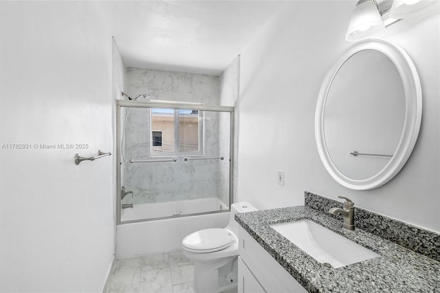 bathroom featuring toilet, shower / bath combination with glass door, marble finish floor, and vanity
