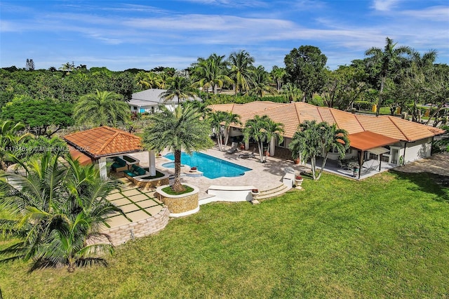 outdoor pool with a yard, a patio area, and a gazebo