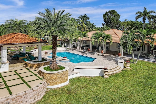 pool featuring a patio area, a gazebo, and a lawn