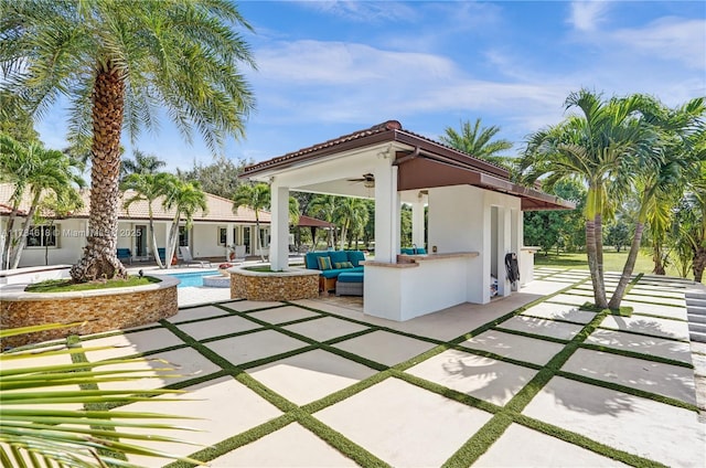view of patio / terrace with an outdoor pool, an outdoor hangout area, and ceiling fan