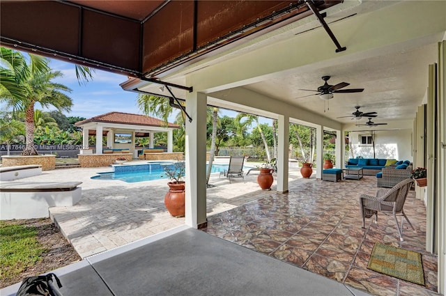 view of patio featuring an outdoor pool, a gazebo, an outdoor hangout area, and fence