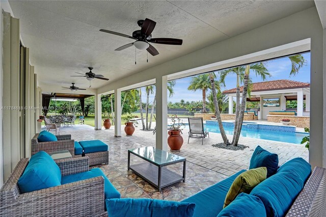 view of patio featuring outdoor lounge area and an outdoor pool