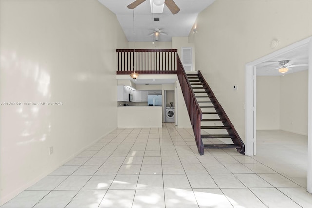 1903 Players Pl, North Lauderdale, FL 33068 - stairway with washer / dryer, a ceiling fan, high vaulted ceiling, and tile patterned flooring