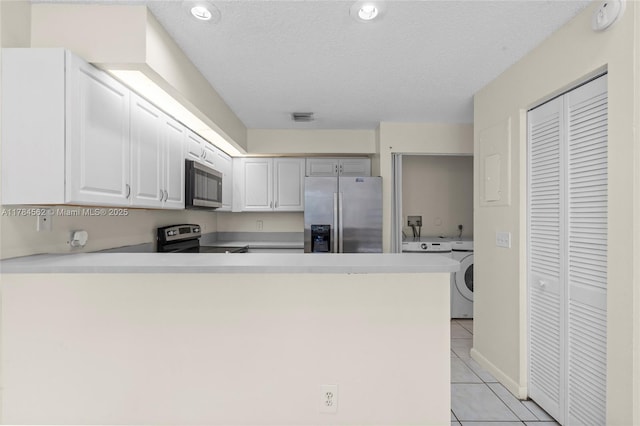 1903 Players Pl, North Lauderdale, FL 33068 - kitchen featuring stainless steel appliances, light tile patterned flooring, a peninsula, light countertops, and white cabinets