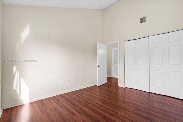 1903 Players Pl, North Lauderdale, FL 33068 - unfurnished bedroom with high vaulted ceiling, wood finished floors, and a closet