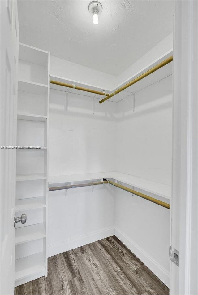 1021 NE 110th St, Biscayne Park, FL 33161 - spacious closet featuring wood finished floors