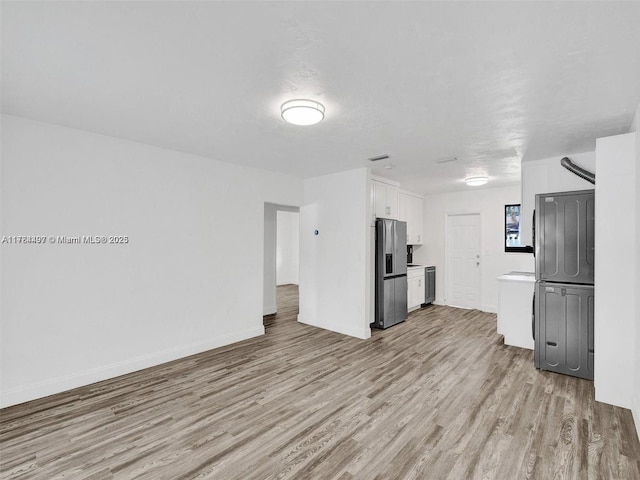 1021 NE 110th St, Biscayne Park, FL 33161 - unfurnished living room with light wood-style floors, baseboards, and visible vents