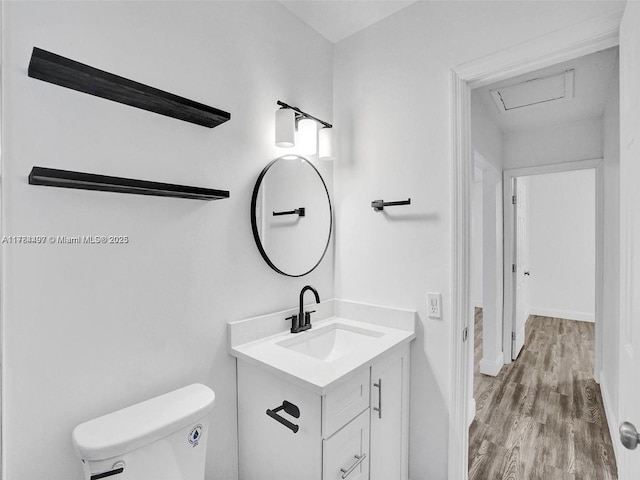 1021 NE 110th St, Biscayne Park, FL 33161 - bathroom with vanity, baseboards, toilet, and wood finished floors